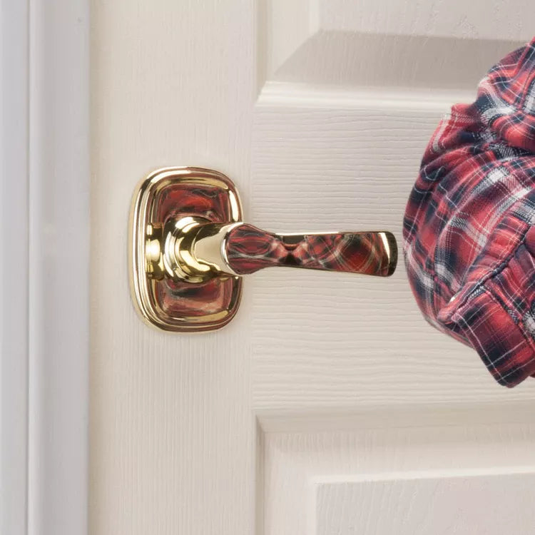 Person pushing a residential door lever with elbow.